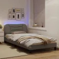 Cadre de lit avec lumières LED taupe 100x200 cm tissu