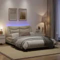 Cadre de lit avec lumières LED crème 140x200 cm tissu