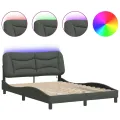 Cadre de lit avec lumières LED gris foncé 140x190 cm tissu