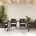Table de jardin avec dessus en verre marron résine tressée