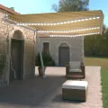 Auvent manuel rétractable avec LED 600x350 cm Jaune et blanc