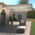 Auvent manuel rétractable avec LED 500x350 cm Crème
